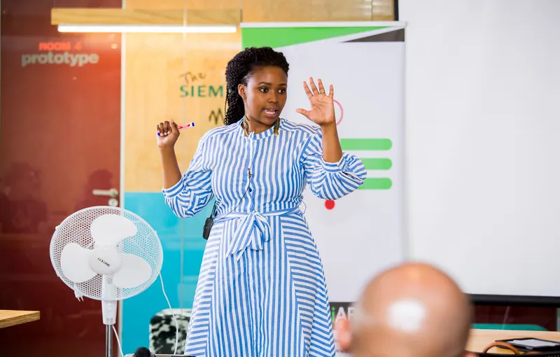 A facilitator guiding participants during an innovation workshop